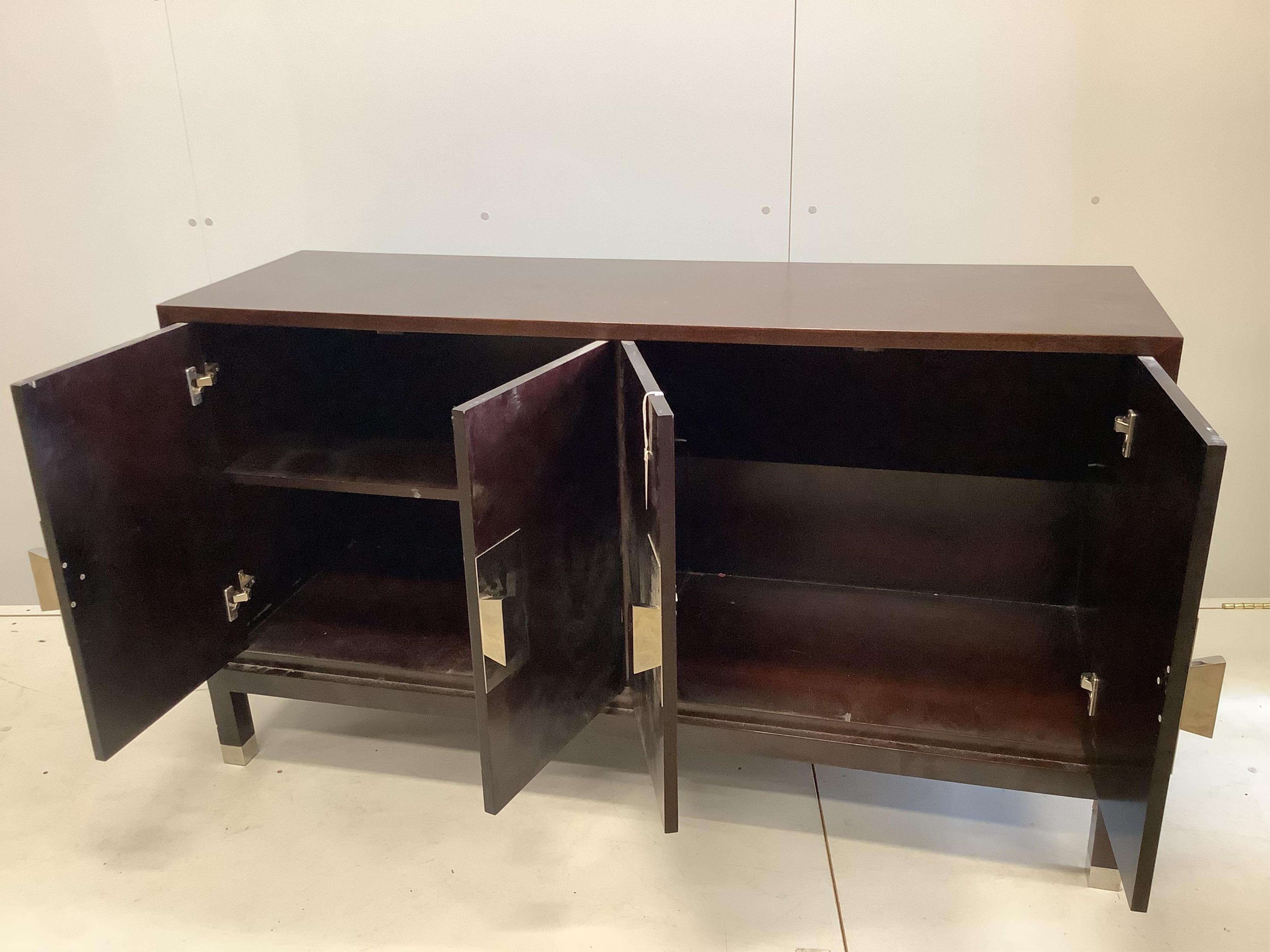 A Contemporary chrome mounted ebonised sideboard, width 150cm, depth 46cm, height 85cm. Condition - fair